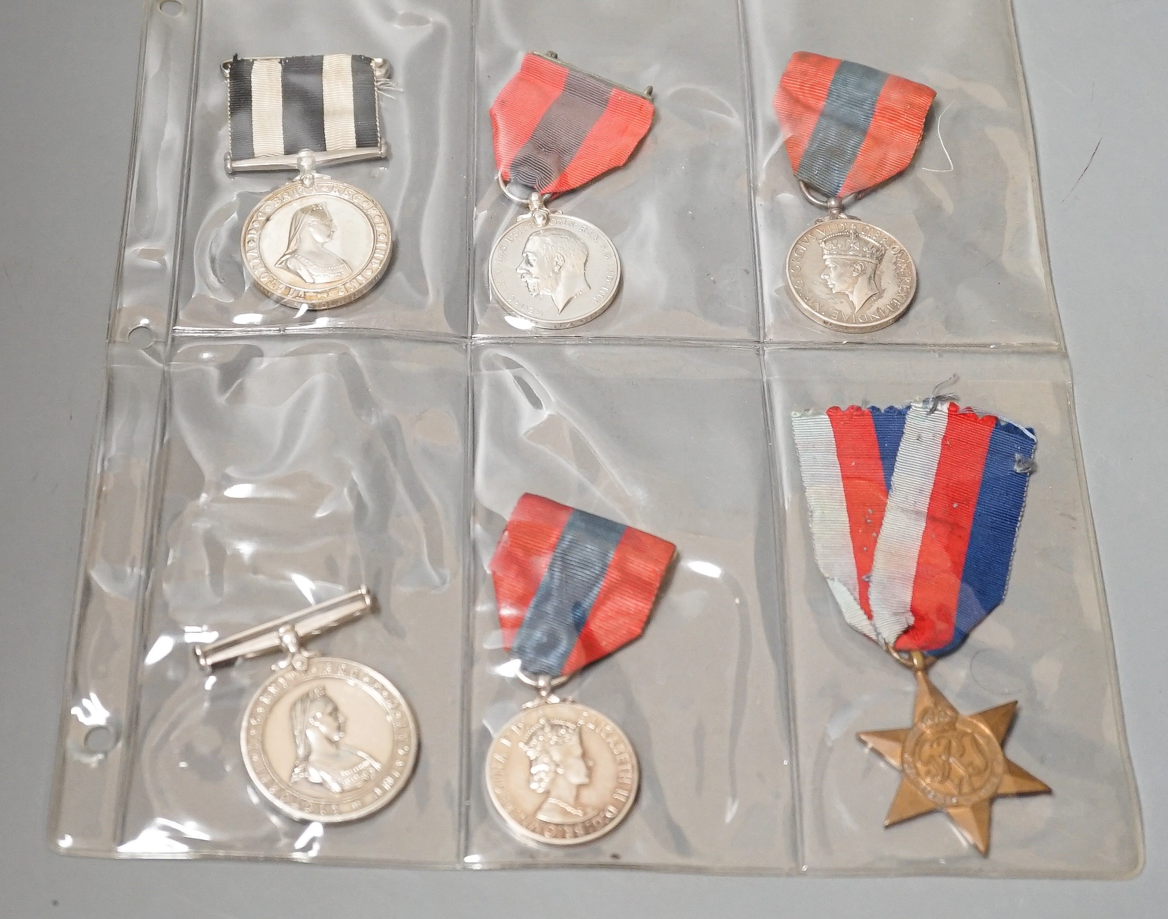 Three Imperial Service medals to Edward James Parker, William Horsfield and Albert Edward Ellis and two Service medals of the Order of St John to 13472 A/SIS.M.TIDMAN.BRISTOL.NO.1.NSG.DIV.NO.2DIS.JAB. 1935 and E692 SGT.